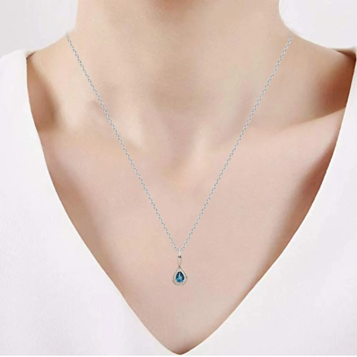 Jewelili  Sterling Silver and 10K Rose Gold With London Blue Topaz and 1/4 CTTW Diamonds Two Tone Infinity Teardrop Pendant Necklace
