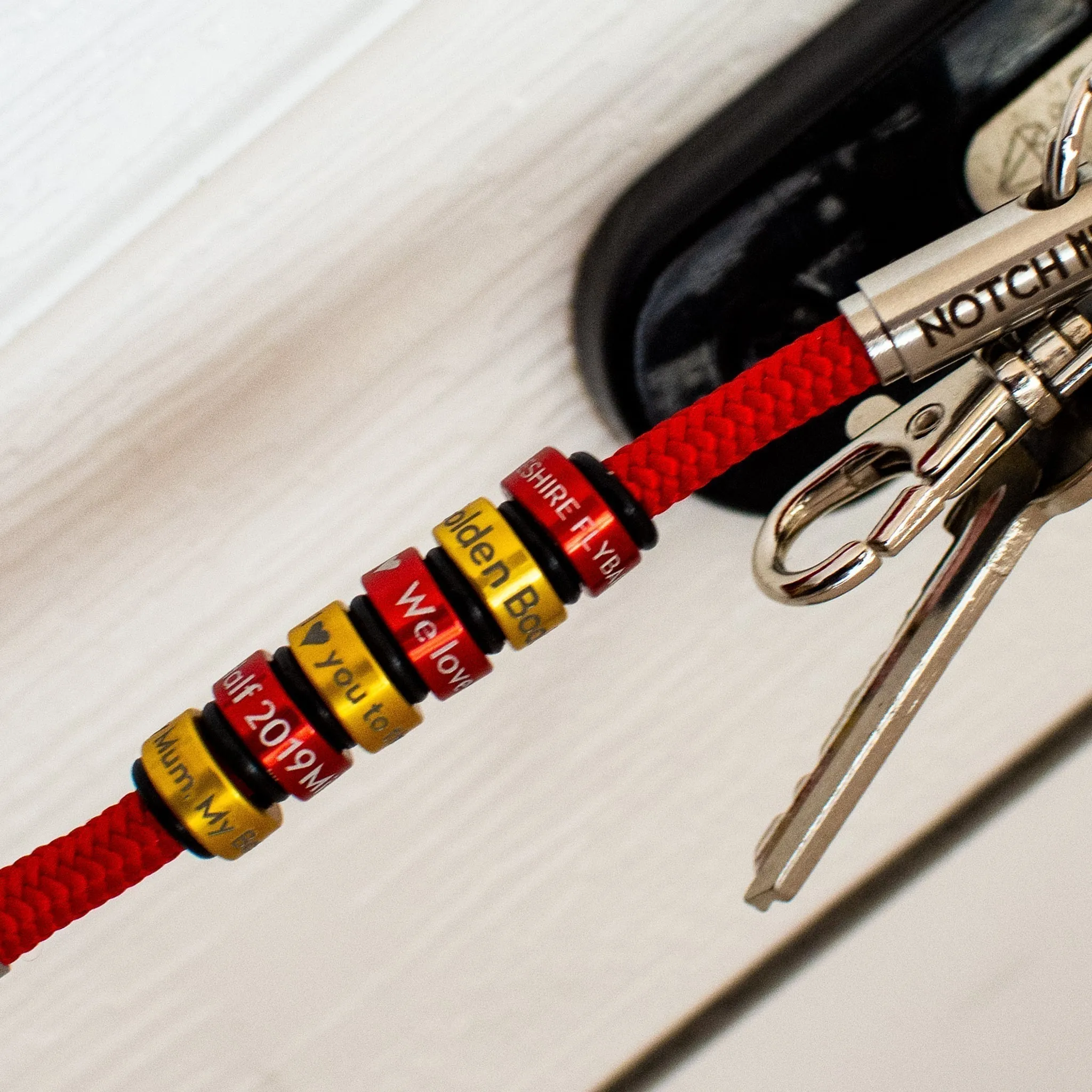 Platinum Warrant NOTCH Charm